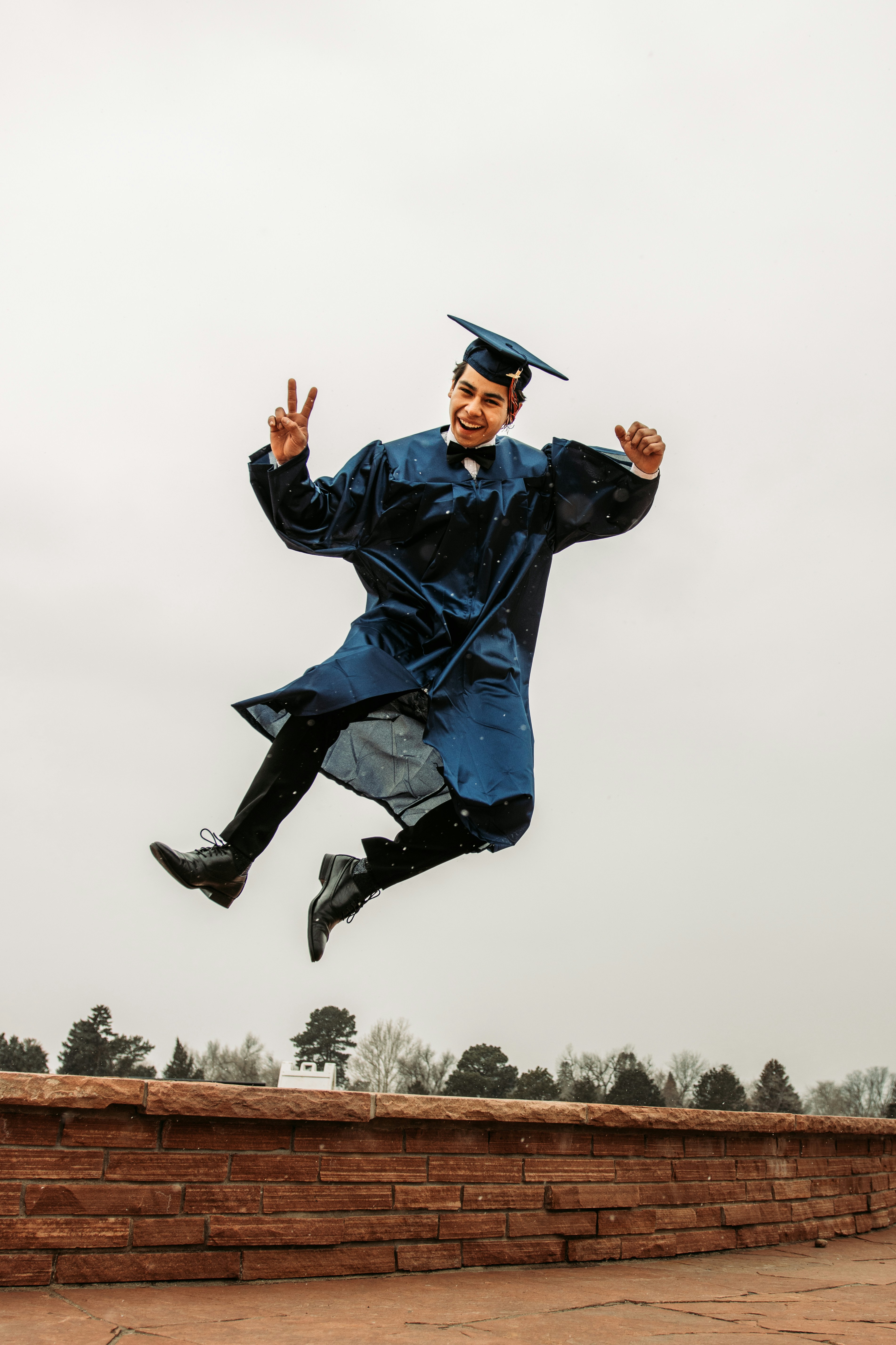 Man in black academic dress and black mortar board